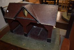 A vintage wooden stable, having Heraldic shield