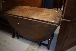 An early to mid 20th Century oak gateleg dining table