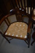 An Art Nouveau mahogany chair frame with typical inlaid back, seat in need of restoration ,