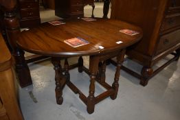 A nice quality modern reproduction drop leaf occasional/coffee table