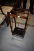 An early 20th century oak stick or umbrella stand , with tin drip tray