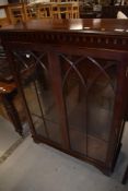A reproduction mahogany display cabinet