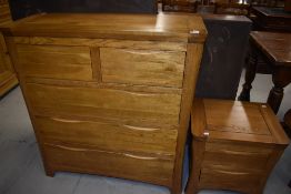 Two modern golden oak bedroom/bedisde chests having concealed integral handles