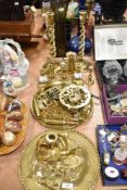 A mixed lot of brass ware, twist stem candlestick,s tray, trivet, shell cases and more to be
