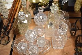A mixed lot of vintage glass to include cut and pressed glass, including decanters, dressing table