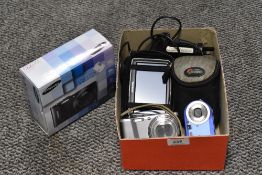 A box of cameras and a Tom Tom, including Samsung WB720.