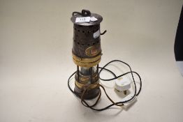 A Patterson lamps Ltd, Gateshead on Tyne miners lamp, having been converted to an electric desk