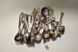 A small box of plated Queens pattern cutlery and a silver tone donkey study.