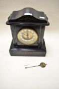 A Victorian marble mantel clock having green veined columns to sides, etched detailing to front