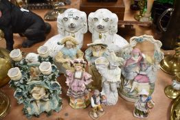 A pair of Stafforshire flat back dogs, and a varied lot of classically styled figurines.
