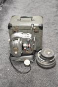 A vintage 1950s Noris-8 Synchromer super projector with case and film reels.