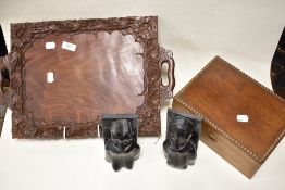 A trio of vimntage treen items, to include intricately carved tray, having decoration of leaves to