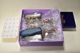 An assortment of optical screws, accessories, glasses and frames.