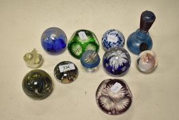 A varied lot of paperweights, a perfume bottle and iridescent mushroom with metal dragonfly.