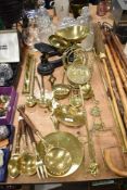 A set of cast metal scales with brass bowls, chestnut roasters, ladles and more.