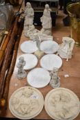 A selection of 19th century parion ware plaques and figurines having classical design, inclduing
