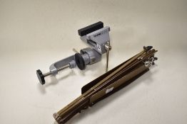 A work desk mounted vice and a vintage sheet music stand.