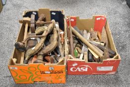 A box of vintage hand tools, including bit and braces, planes and more.