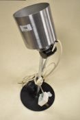 A vintage brushed steel posable lamp.