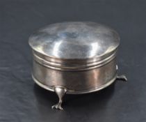 A Geirge V silver jewellery box, of circular form with slightly domed and hinged cover enclosing the