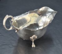 A George VI silver gravy boat, of traditional design , marks for Birmingham 1940, maker Adie