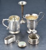 An Elizabeth II silver milk jug, with short spout and stepped circular foot, marks for Birmingham