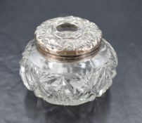 A white metal topped cut-glass hair tidy, lacking marks and denting and wear throughout.