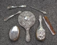 A group of mixed silver mounted dressing table wares, to include hand mirror, hair brush, clothes