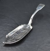A George IV silver fish server, fiddle pattern with pip reverse, the shaped blade with pierced