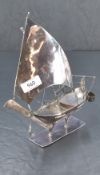 A white metal Chinese junk sailing boat with stand both testing as silver, 24cm tall weighing 281g