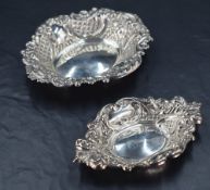 An Elizabeth II silver dish, of oval form embossed with C-scrolls foliate motifs and diaper