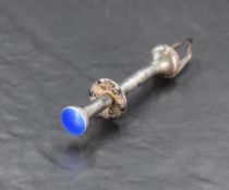 A pair of early 20th century white metal and enamel sugar nips, having moulded decoration,