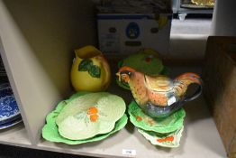 A collection of early 20th century Carlton Ware cabbage pattern plates and a Rooster tea pot.
