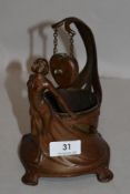 An Art Nouveau container, in coppered patinated pewter with a female figure draped around a