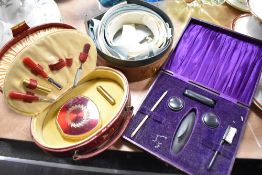 A 1930s vanity case with partial contents, another similar example and a box of collars.
