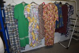 A mixed lot of predominantly 1970s and 80s dresses and skirts.