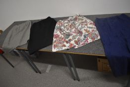 A selection of ladies retro pencil skirts and a floral cotton skirt.