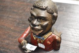 A genuine cast iron mechanical money box.