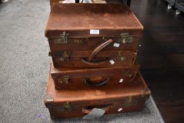 Four early 20th century graduated leather bound briefcases