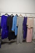 A selection of 1970s and 80s clothing, including Jean Muir coat and Jaeger dress in electric blue.