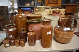 A collection of late 19th early 20th century earthen ware pottery including two Doulton Lambeth jugs