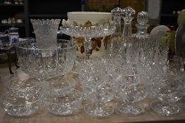 A selection of clear cut crystal glass wares including Brierley sundae dishes, champagne flutes,