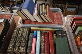 A carton of books covering different topics of Law, Business and Finance including 'Capitalism and