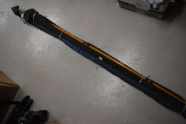 A Daiwa sensor carbon spin 3.05m, A Shakespeare strike 3.90m and a wooden boat rod