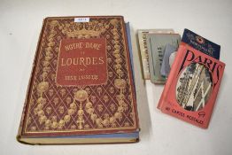 Paris. A selection of souvenir postcards with a related book.