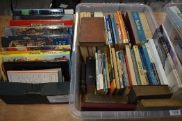 A carton of various books of different topics including a small collection of Pelican paper backs