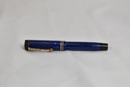 A Parker Duofold Jr button fill fountain pen in lapis blue with two bands to the cap having Parker