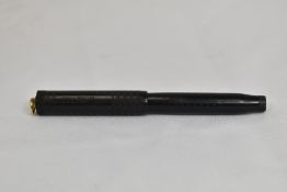 A Parker Jack Knife 20 1/2 Lucky Curve button fill fountain pen in BCHR with ring top to cap and