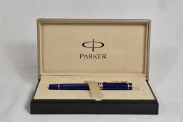 A boxed Parker Duofold International MKII converter fountain pen in blue with two bands to the cap