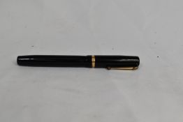 A Mabie Todd & Co Swan lever fill fountain pen in black with single broad band to the cap having